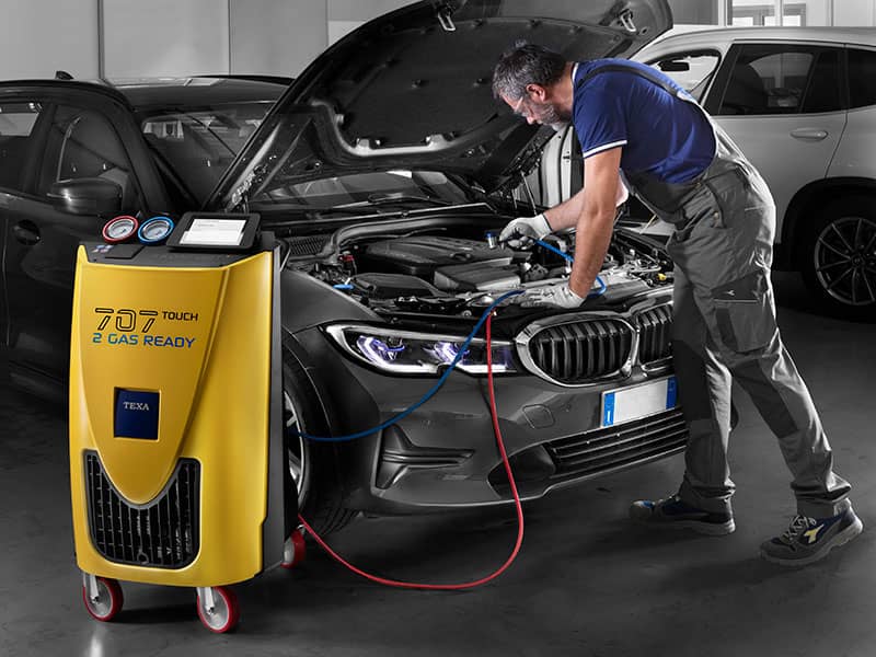 Car air conditioning being regassed in Buckley